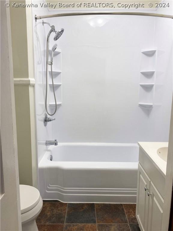 full bathroom featuring shower / bathtub combination, toilet, and vanity