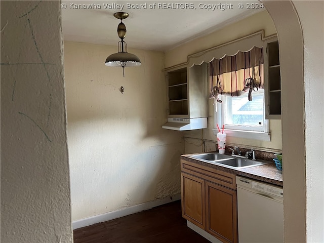 kitchen featuring dishwasher, dark hardwood / wood-style flooring, sink, and pendant lighting