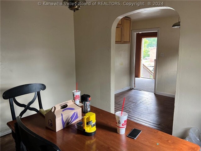 dining space featuring wood-type flooring