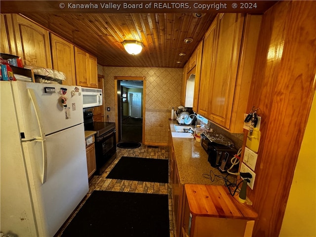 kitchen with wooden counters, wood ceiling, white appliances, and sink