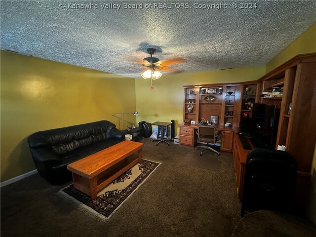 carpeted living room with ceiling fan and a textured ceiling