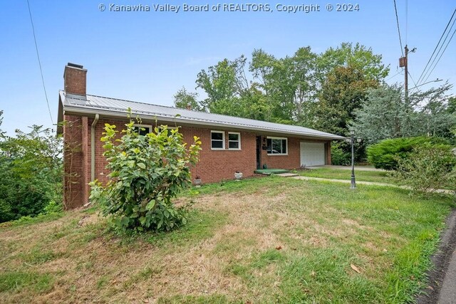 rear view of property with a yard