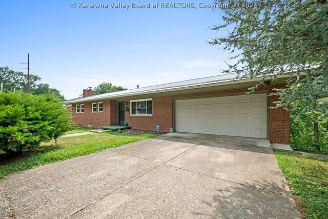 ranch-style house featuring a garage