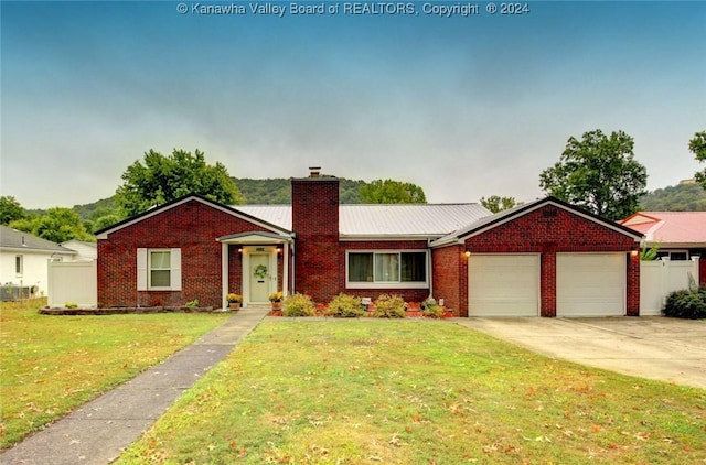 ranch-style home with a garage and a front yard