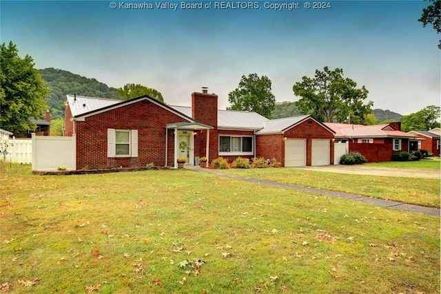 single story home with a garage and a front yard