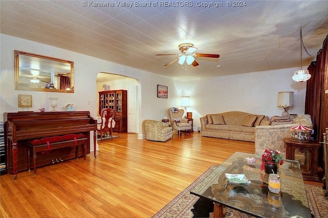 living room with hardwood / wood-style flooring and ceiling fan