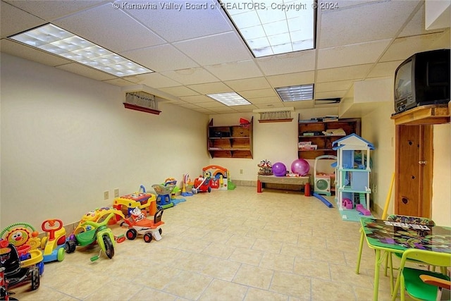 game room featuring a drop ceiling