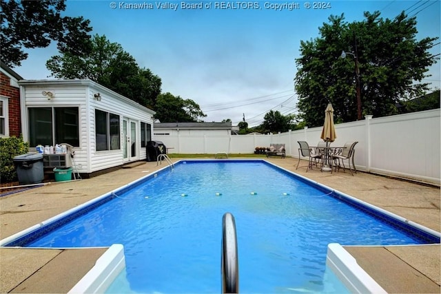 view of pool featuring a patio area