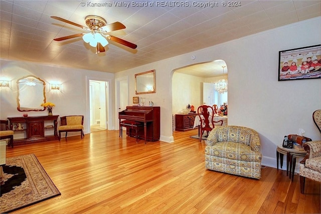 living area with ceiling fan and light wood-type flooring