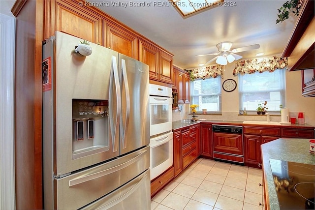 kitchen featuring stainless steel fridge with ice dispenser, light tile patterned floors, white double oven, black electric stovetop, and paneled dishwasher