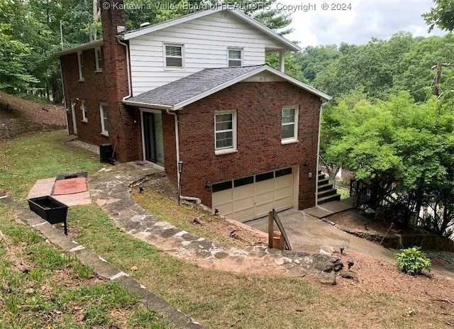 view of home's exterior featuring a garage and central air condition unit