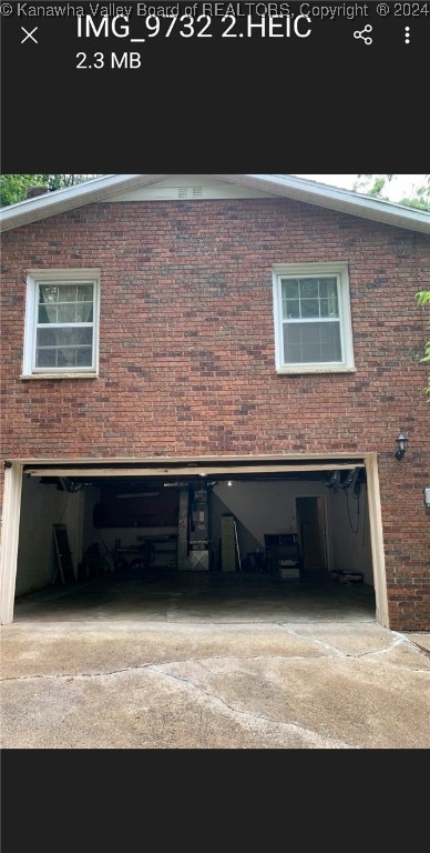 view of side of property with a garage