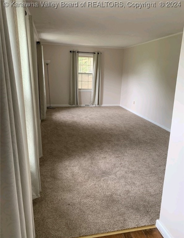 empty room with carpet flooring