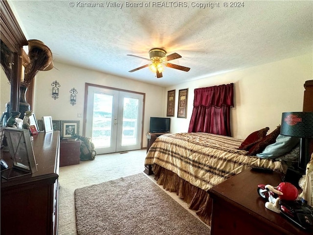 bedroom with access to outside, ceiling fan, light carpet, a textured ceiling, and french doors