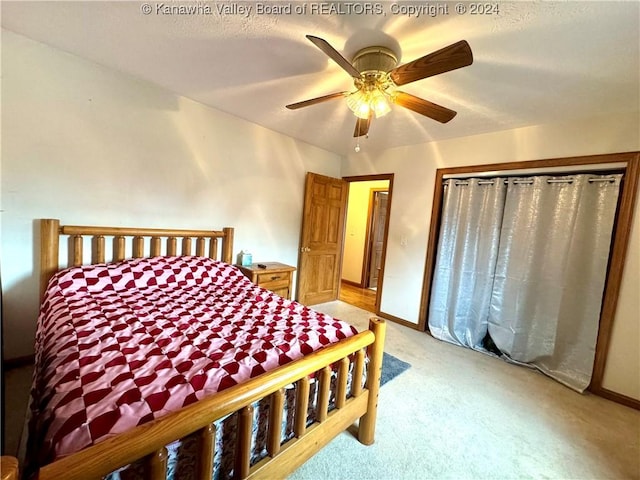 bedroom with ceiling fan and light colored carpet