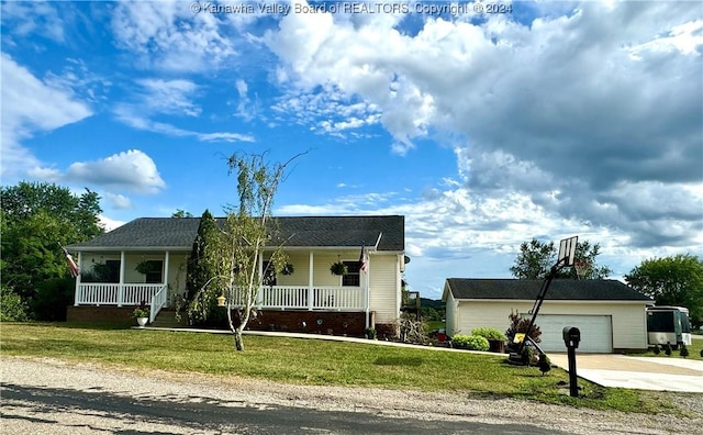 single story home featuring a garage, a front yard, and covered porch