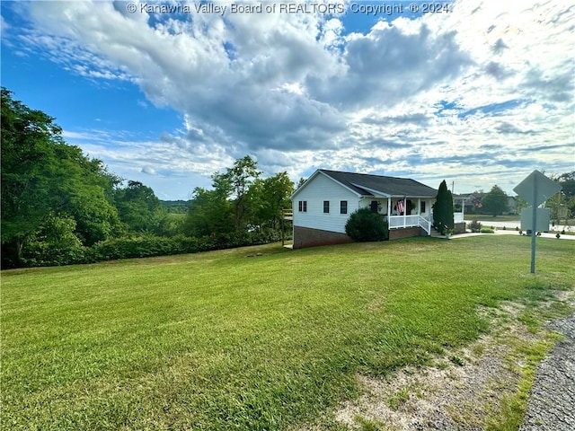 view of yard with covered porch