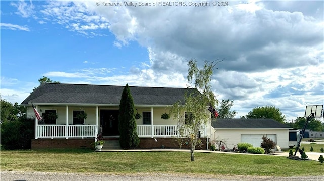 ranch-style house with a garage, a front yard, and a porch