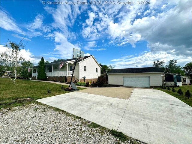 view of front of property with a garage and a front yard