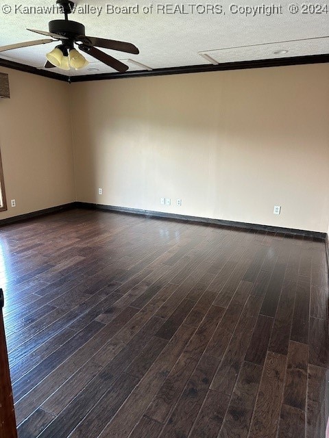 spare room featuring a textured ceiling, ceiling fan, wood-type flooring, and ornamental molding