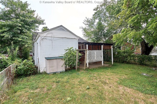 rear view of property with a lawn