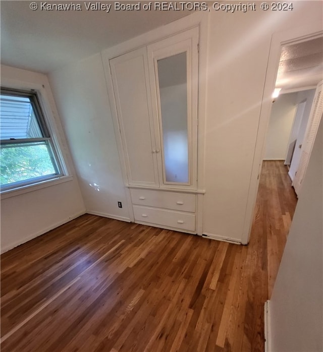 unfurnished bedroom featuring hardwood / wood-style floors