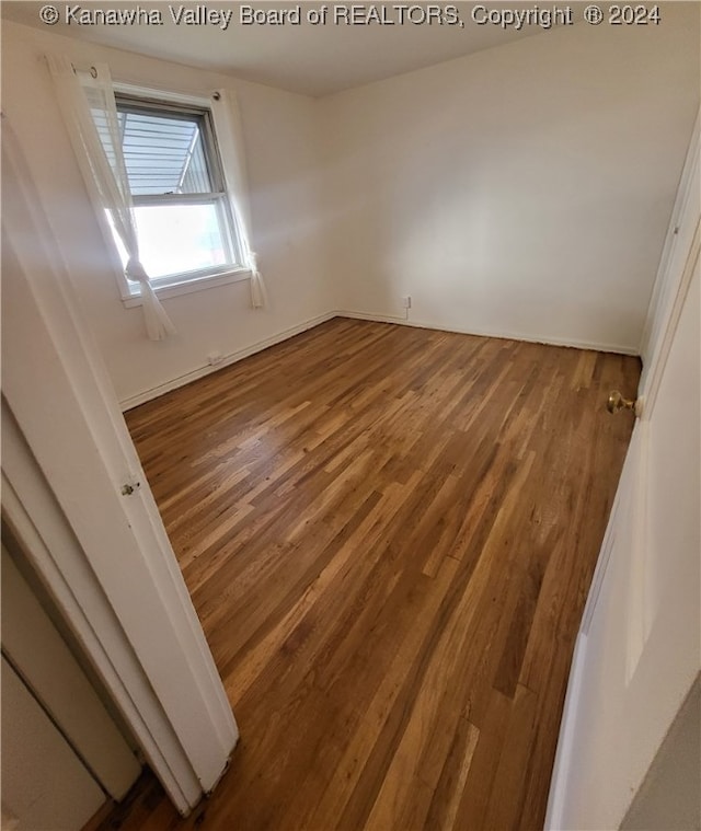 spare room featuring hardwood / wood-style flooring