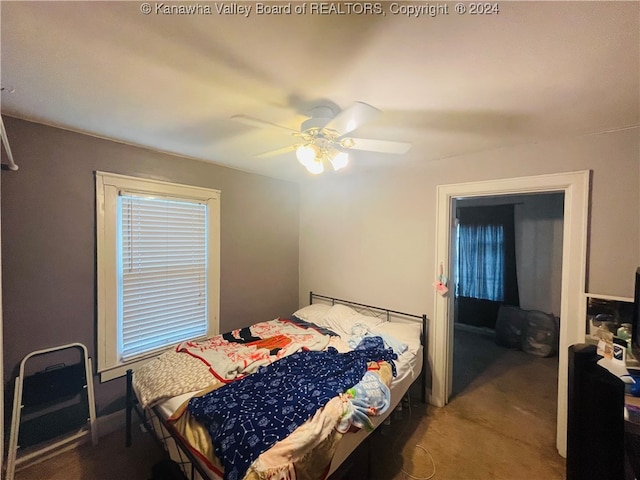 carpeted bedroom with ceiling fan