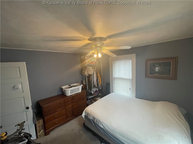 carpeted bedroom featuring ceiling fan