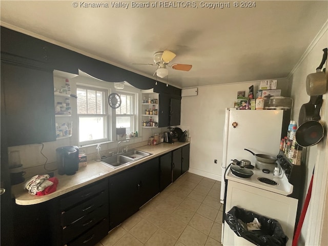 kitchen featuring white range oven, light tile patterned floors, crown molding, ceiling fan, and sink