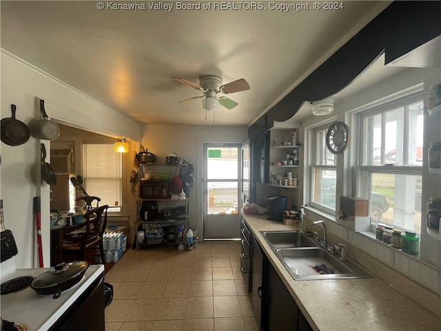 kitchen with light tile patterned floors, white stove, crown molding, ceiling fan, and sink