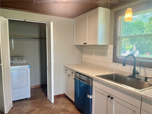 kitchen featuring white cabinetry, stainless steel dishwasher, washer / clothes dryer, backsplash, and sink