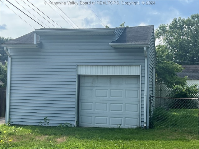 garage with a yard