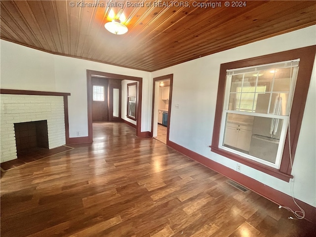 unfurnished living room featuring wood ceiling, a fireplace, and hardwood / wood-style floors