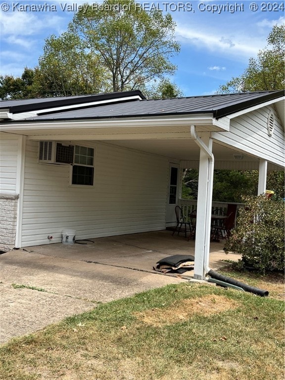 rear view of property featuring a patio and a lawn