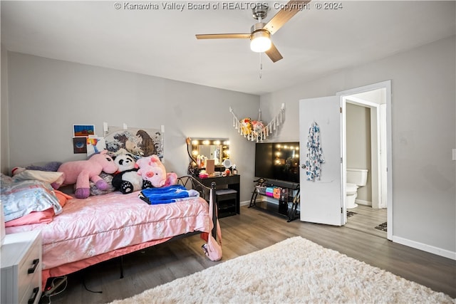 bedroom featuring ceiling fan, hardwood / wood-style floors, and connected bathroom