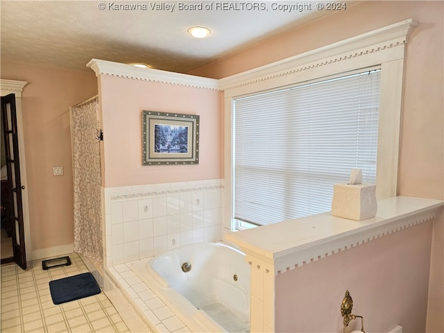 bathroom featuring tiled bath and tile patterned floors