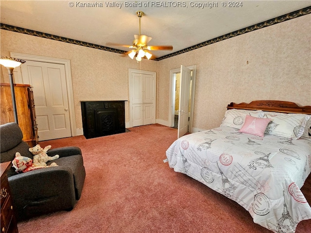 bedroom with ceiling fan and carpet floors