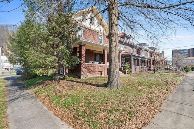 view of front of home with brick siding