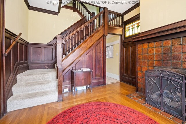 interior space with light parquet flooring and ornamental molding