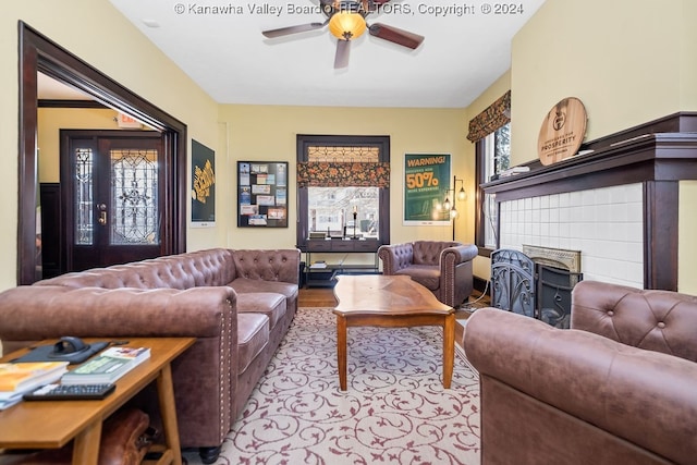 living room with ceiling fan and wood-type flooring