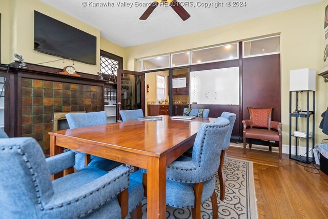 dining area with ceiling fan and wood-type flooring