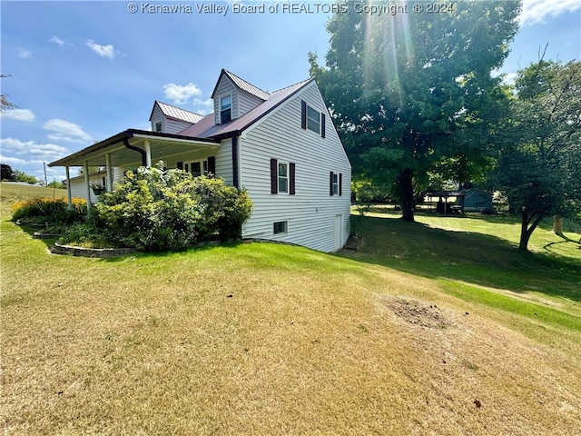 view of home's exterior featuring a lawn