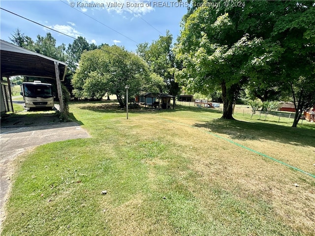 view of yard with a carport