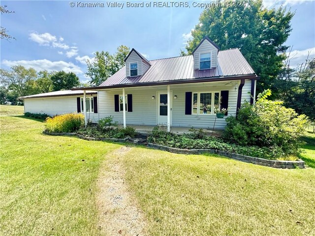 new england style home with a front lawn and a porch