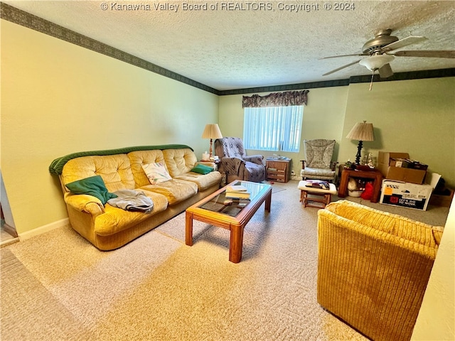 carpeted living room featuring a textured ceiling and ceiling fan