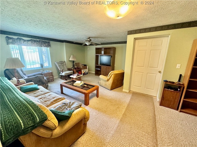 living room featuring a textured ceiling, ceiling fan, and light colored carpet