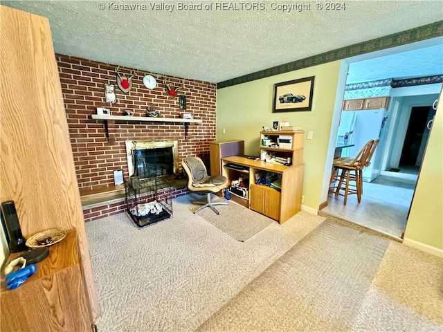 living room with a textured ceiling, brick wall, carpet flooring, and a brick fireplace