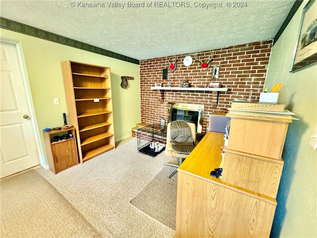 carpeted office space with a fireplace, a textured ceiling, and brick wall