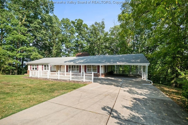 single story home featuring covered porch, a front yard, and a carport